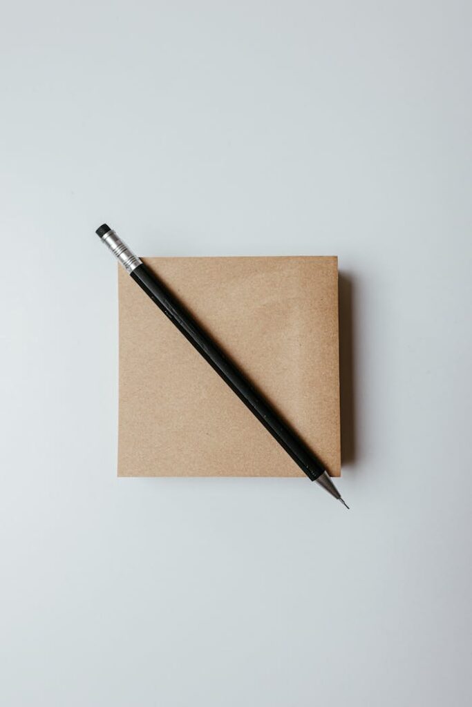 Close-Up Shot of a Pen on a Notepad